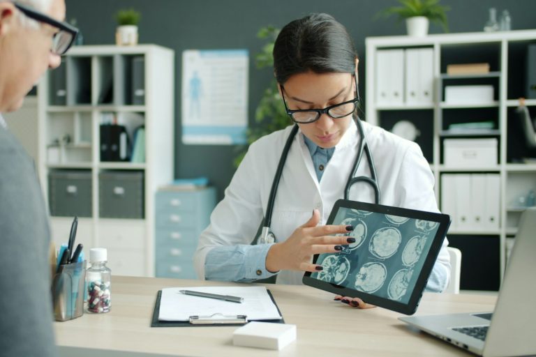 nurse assisting senior patient home care clinical comfort health