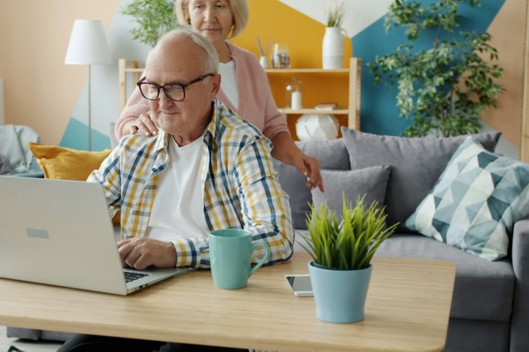 Evaluating Off-Exchange Private Individual Health Policies, Short-Term Plans, and Indemnity Packages family reviewing financial insurance documents living room desk consultation