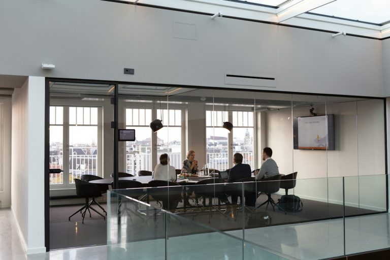 Implementing Individual Coverage Health Reimbursement Arrangements Under Modern ERISA Standards business executives conference room corporate health insurance contract