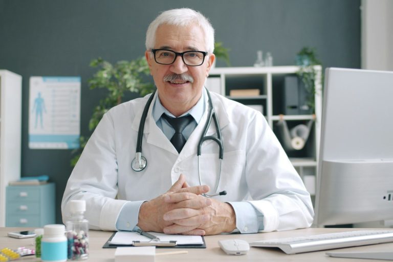 Mastering Health Insurance Prior Authorization Protocols and Expedited Clinical Dispute Timelines medical doctor reviewing patient health insurance documents clinical records office