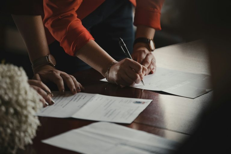 corporate human resources open enrollment employee benefits signing papers