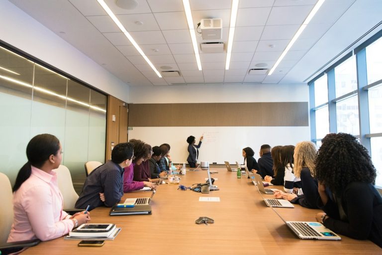 corporate business team meeting human resources benefits planning boardroom